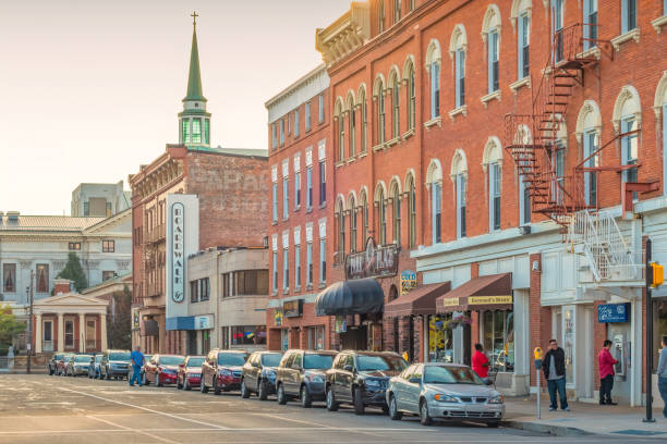 Buckhannon, West Virginia, USA - June 30, 2025: A pickup truck turns onto Main Street in front of a painted mural in downtown Buckhannon.