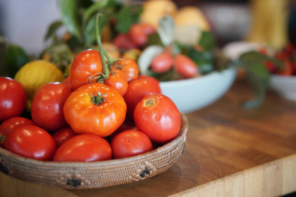 istock fresh tomatoes in basket on wooden table 1308984005