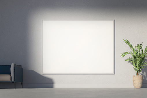Blank white picture frame on isolated white wall with soft shadow