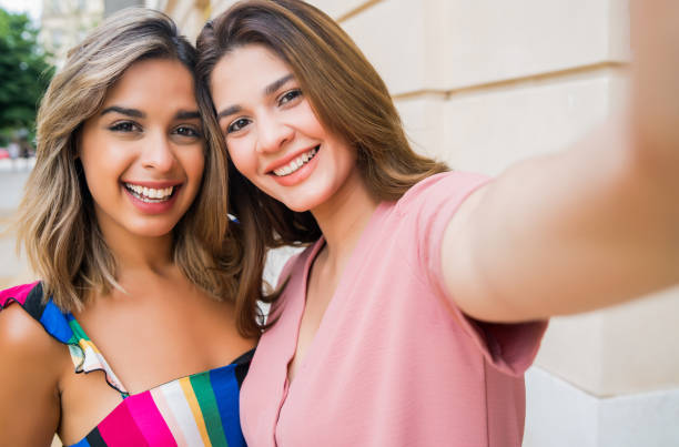 istock Two friends taking a selfie outdoors. 1308985932
