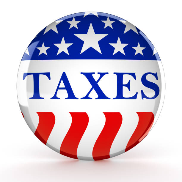 istock Taxes written on a red, white, and blue button 1308986594