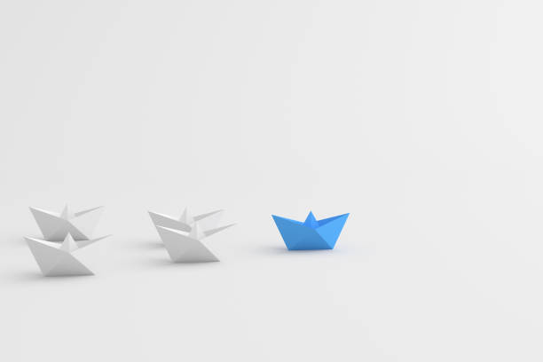 istock Leadership concept, blue leader boat leading white boats, on white background with empty copy space 1308986701