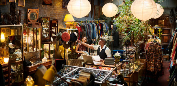 istock vintage shop owner and customer 1308991968