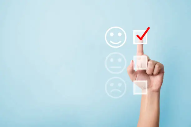 Photo of Hand choose to rating score happy icons. Customer service experience and business satisfaction survey concept