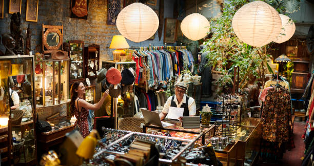 istock vintage shop owner and customer 1308994740