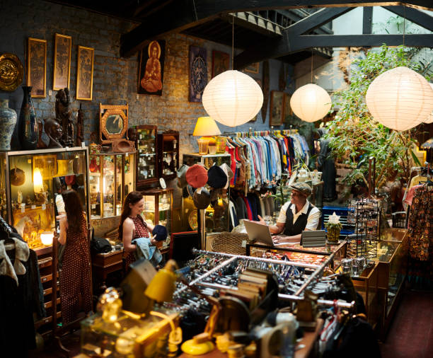 istock vintage shop owner and customer 1308995327