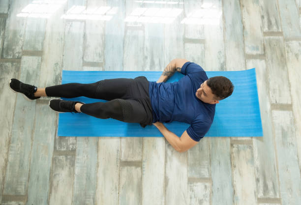 istock Latin man doing abdominal exercises, aerial view 1308997996