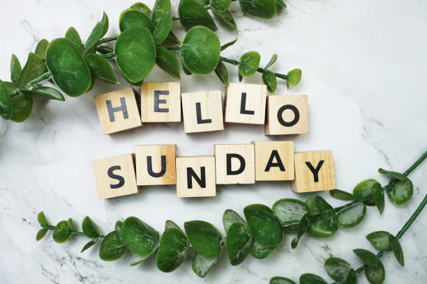 istock Hello Sunday alphabet letter with green leave flat lay on marble background 1308999652