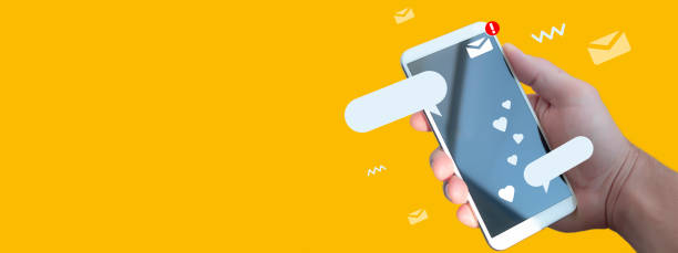 istock Hand of a man with a phone close-up for using social networks, communication. 1308999839