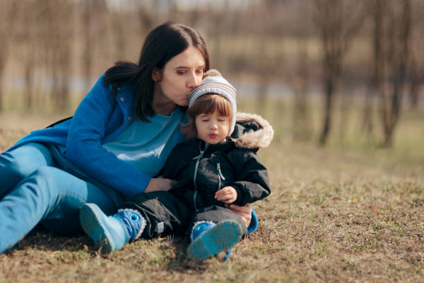 istock Mom Kissing Daughter Outdoors Spending Quality Time 1309002665