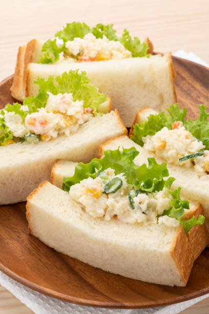 istock Potato salad sandwich, breakfast table 1309008871