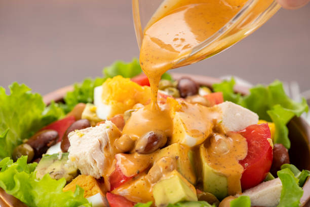 istock Chicken, avocado and tomato Cobb salad on the table 1309009542