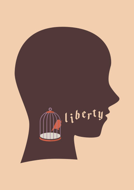 istock Bird in bird cage try to speak liberty word 1309014189