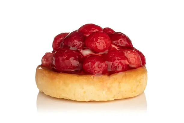 Photo of Fresh fruit pie tart with with raspberry isolated on white