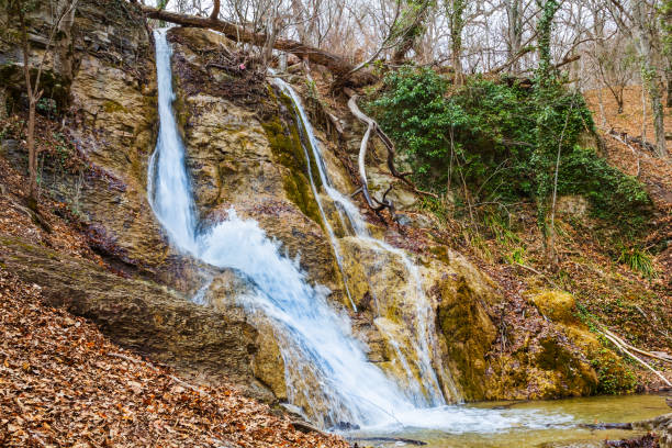 istock beautiful waterfall on a mountain river 1309019875
