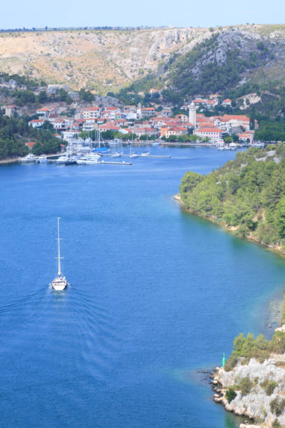 istock Sailboats sail into Skradin 1309020668