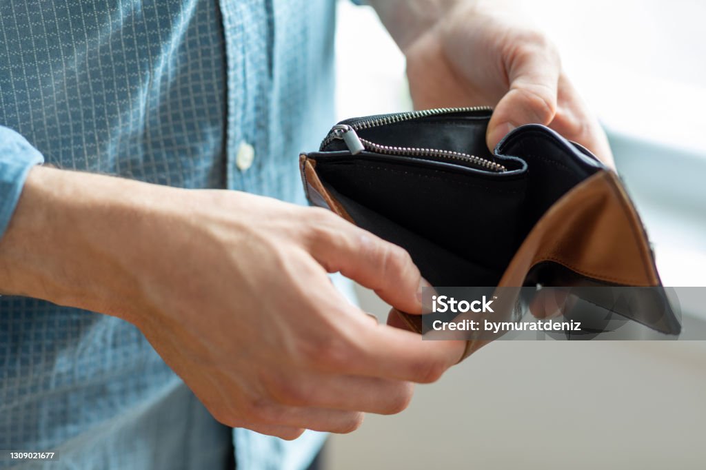 Holding in hands empty wallet Empty Wallet Stock Photo