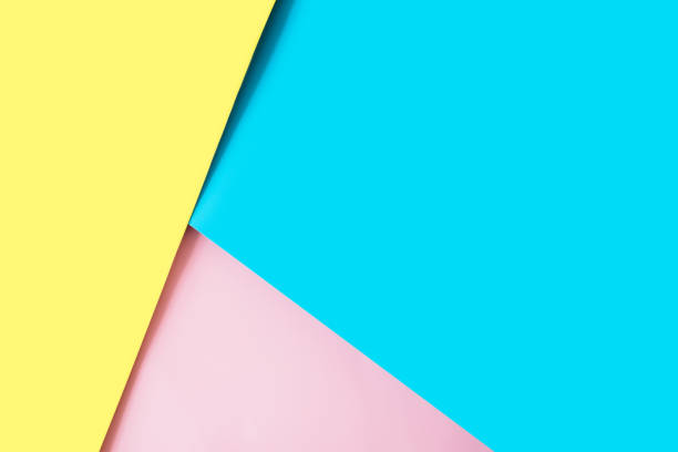 istock Multicolored sheets of paper placed geometrically randomly. Yellow, pink, blue 1309022566
