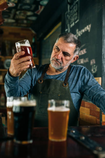 istock barman seving beer in beer bar 1309024659