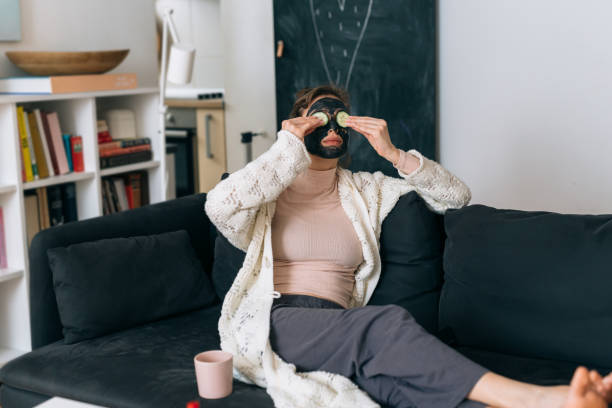 istock woman relaxing at home 1309024662