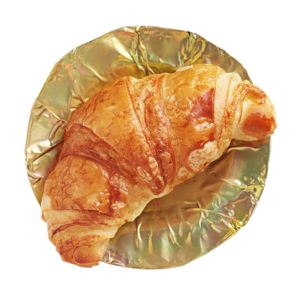 Croissant in an old brass plate