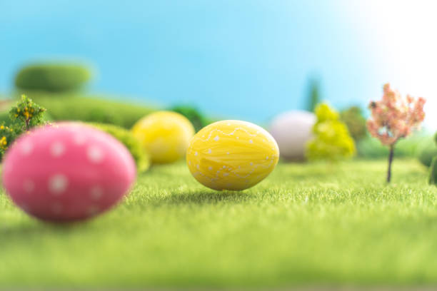 istock Easter egg outside in grass with evening sun from behind 1309030636
