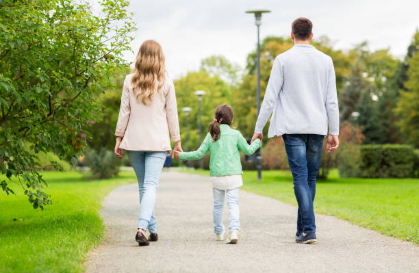 istock happy family walking in summer park 1309031437