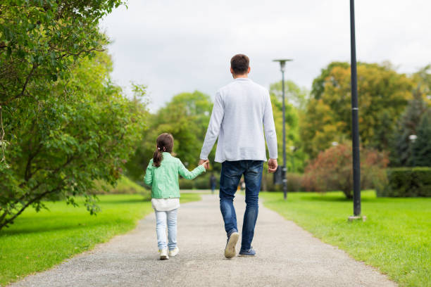 istock happy family walking in summer park 1309031624