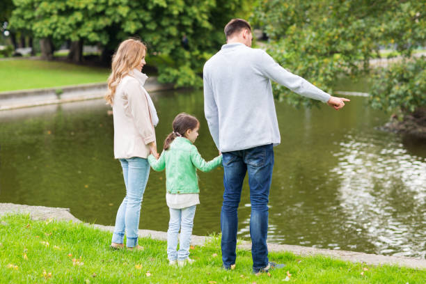 istock family walking in summer park 1309031926