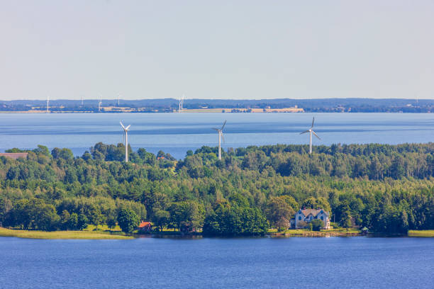 istock Wind turbines on an island in a lake 1309032635