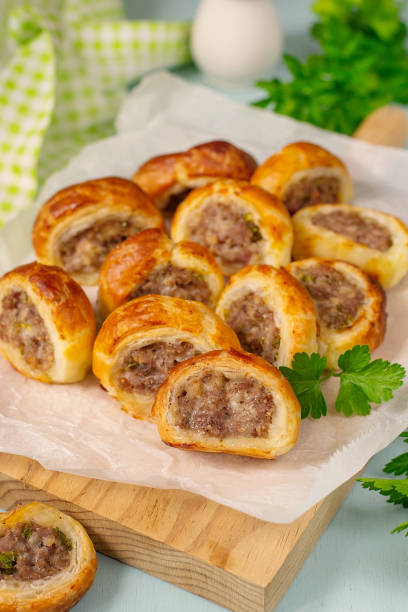 istock Puff paPuff pastry mini sausage rolls with ground beef filling 1309035301