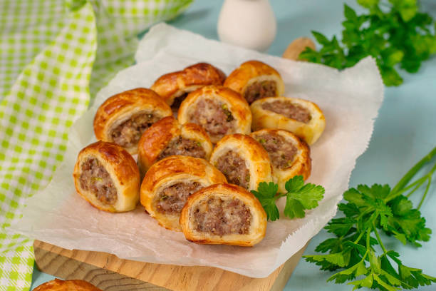 istock Puff paPuff pastry mini sausage rolls with ground beef filling 1309035303