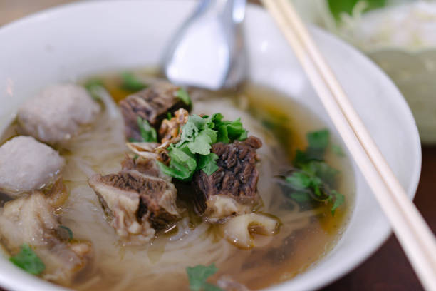 istock Rice noodle soup with Cooked Liver in  bowl on table, selective focus 1309037594