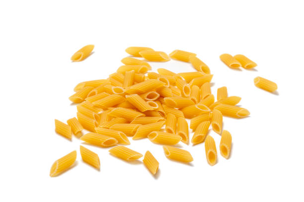 istock penne, mezze penne pasta isolated in white background 1309038010