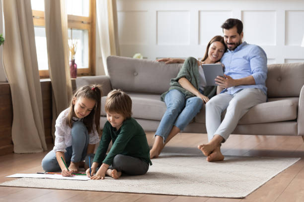 istock Happy young family relax at home on weekend 1309039148