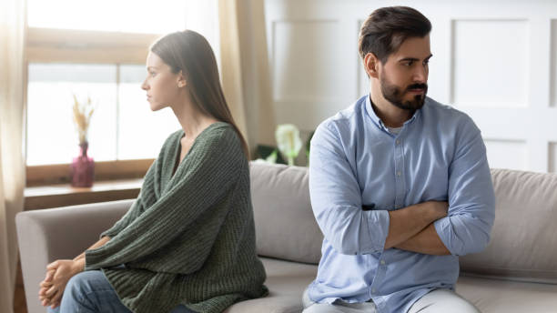 istock Unhappy couple sit separate avoid talking after fight 1309039238