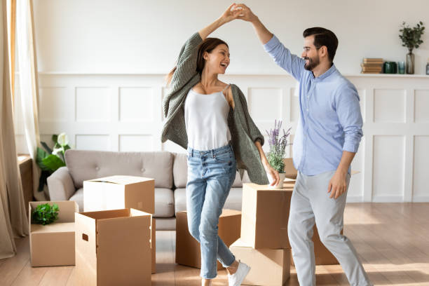 istock Happy couple renters dance on moving day 1309040216