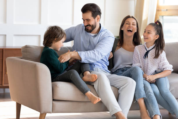 istock Overjoyed parents with two kids play at home 1309040254