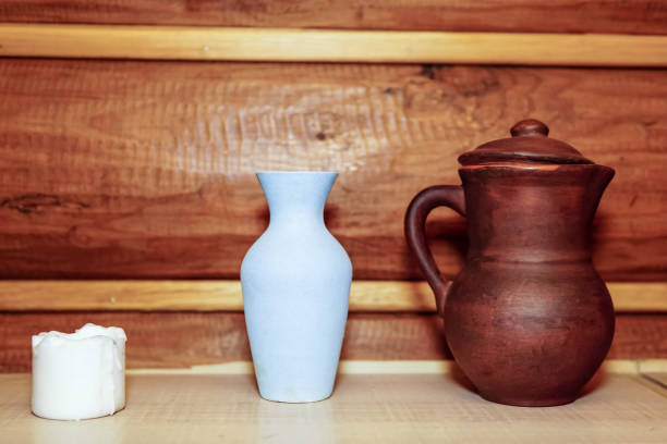 istock A white burnt-out candle. an earthenware jug. ceramic vase 1309040566