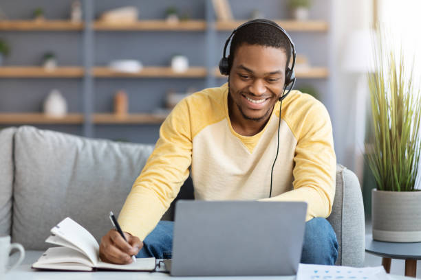 istock Positive black guy attending online training from home 1309042237