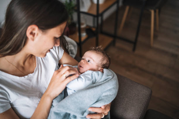 istock Young mother cuddling her baby boy at home. 1309046841