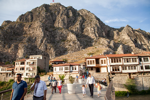 People are visiting the Yesilirmak River area for resting and sightseeing,Amasya,Turkey.28 September 2015.
