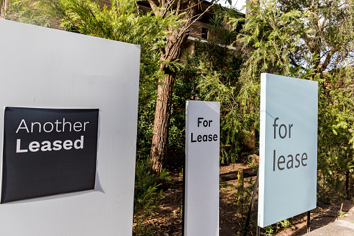 For lease signs outside of a residential building in Australia. Renting market