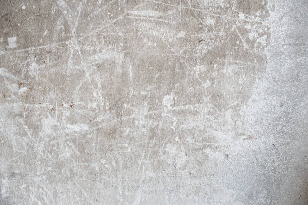 istock trendy loft style background. gray concrete background with white cracks and scratches for an inscription. copy space. space for text on the wall. 1309048077