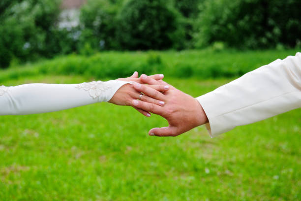 istock People's hands on the wedding day. 1309048926
