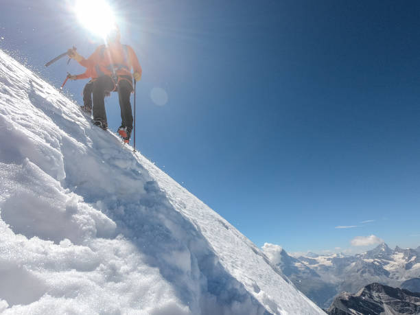 istock Climbing in high altitude mountains with rope. Winter landscape 1309049398