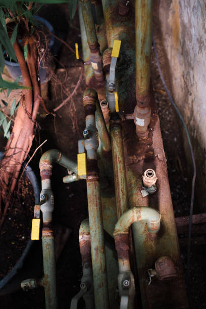 istock Old rusty pipes in the greenhouse close-up 1309049468