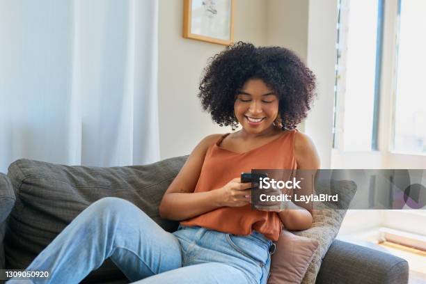Clocking High Scores On Her Favourite Mobile Games Stock Photo - Download Image Now - Women, One Woman Only, Mobile Phone