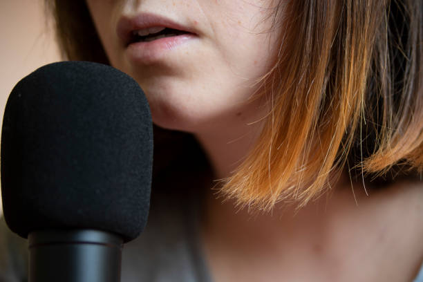 istock woman registring a podcast 1309050934