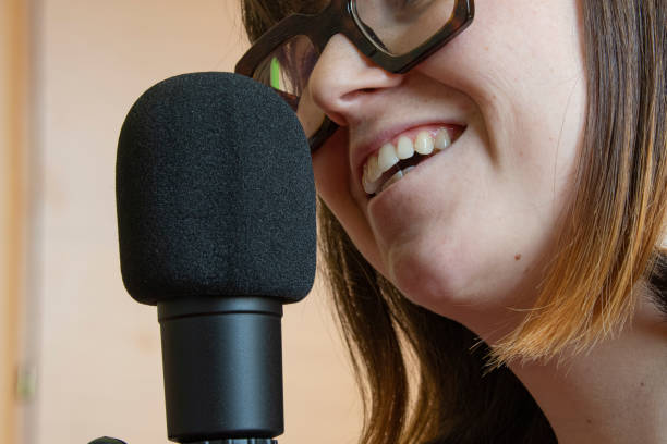 istock woman registring a podcast 1309051014